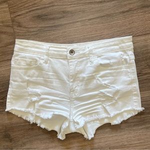 Stretchy white distressed jean shorts